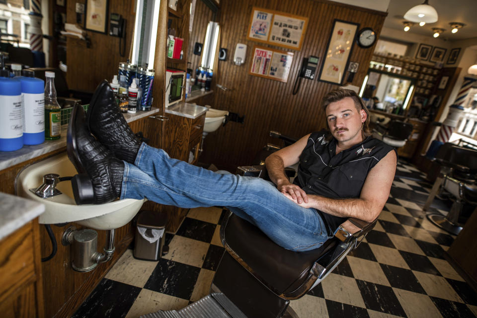 Country singer Morgan Wallen poses for a portrait after getting a mullet at Paul Mole Barber Shop on Tuesday, Aug. 27, 2019, in New York. Wallen, who has turned heads with his likable hit song “Whiskey Glasses," said he decided to try a mullet after seeing old photos of his dad proudly rocking the hairstyle. (Photo by Charles Sykes/Invision/AP)