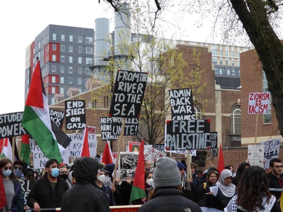 Pro-Palestine protesters march through downtown State College on Saturday afternoon for many of the same demands they made during a Thursday protest — including for Penn State to divest from Israel and to free Palestine.