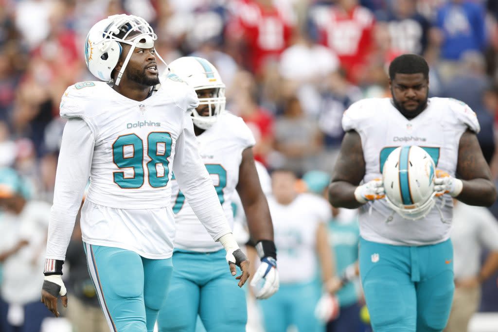 Sep 18, 2016; Foxborough, MA, USA; Miami Dolphins defensive end Jason Jones (98) reacts during the fourth quarter against the New England Patriots at Gillette Stadium. The New England Patriots won 31-24. Mandatory Credit: Greg M. Cooper-USA TODAY Sports