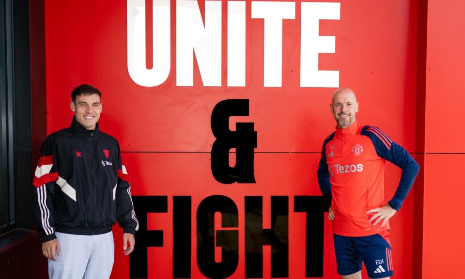 <span>Manuel Ugarte (left) with the Manchester United manager, Erik ten Hag, after agreeing a five-year deal with the club.</span><span>Photograph: Manchester United/Getty Images</span>