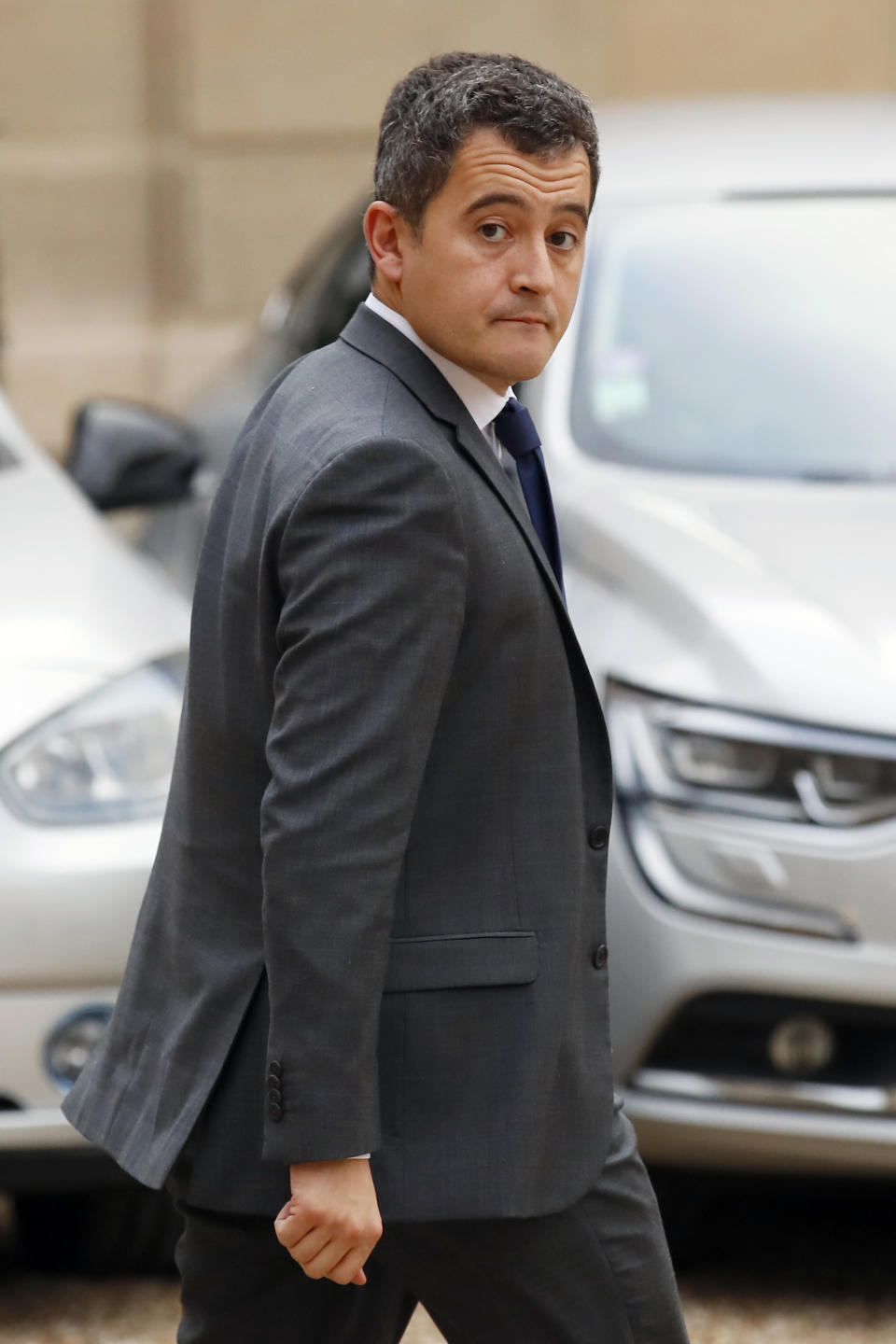 French Budget Minister Gerald Darmanin leaves after a meeting with French President Emmanuel Macron and local, national political leaders, unions, business leaders and others to hear their concerns after four weeks of protests, at the Elysee Palace in Paris, Monday, Dec. 10, 2018. French President Emmanuel Macron is preparing to speak to the nation at last after increasingly violent "yellow vest" protests against his leadership. (AP Photo/Francois Mori)