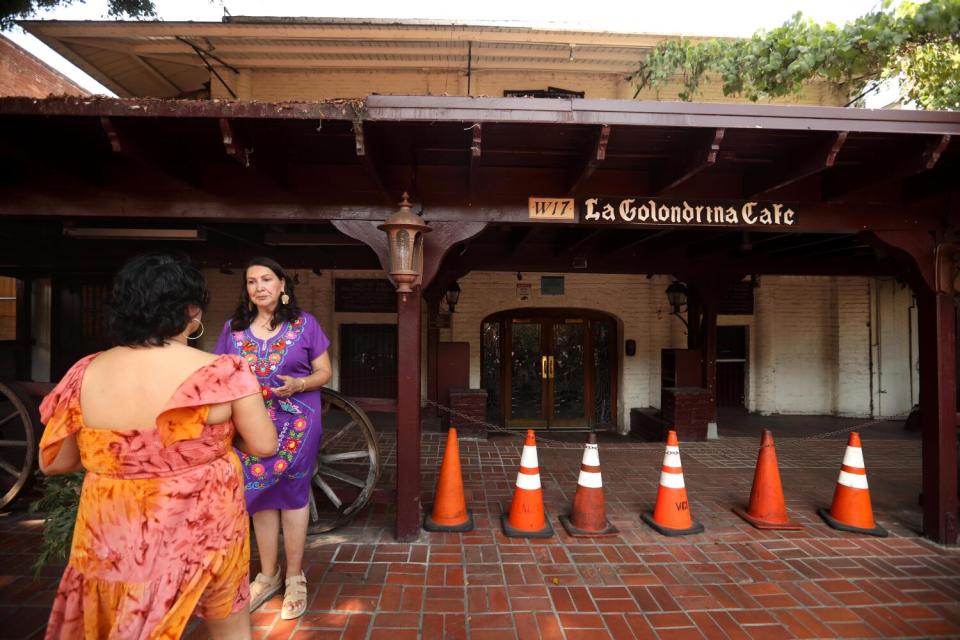 Bertha Gomez, right, talks with Rocio Mendoza, on Olvera Street in El Pueblo de Los Angeles.