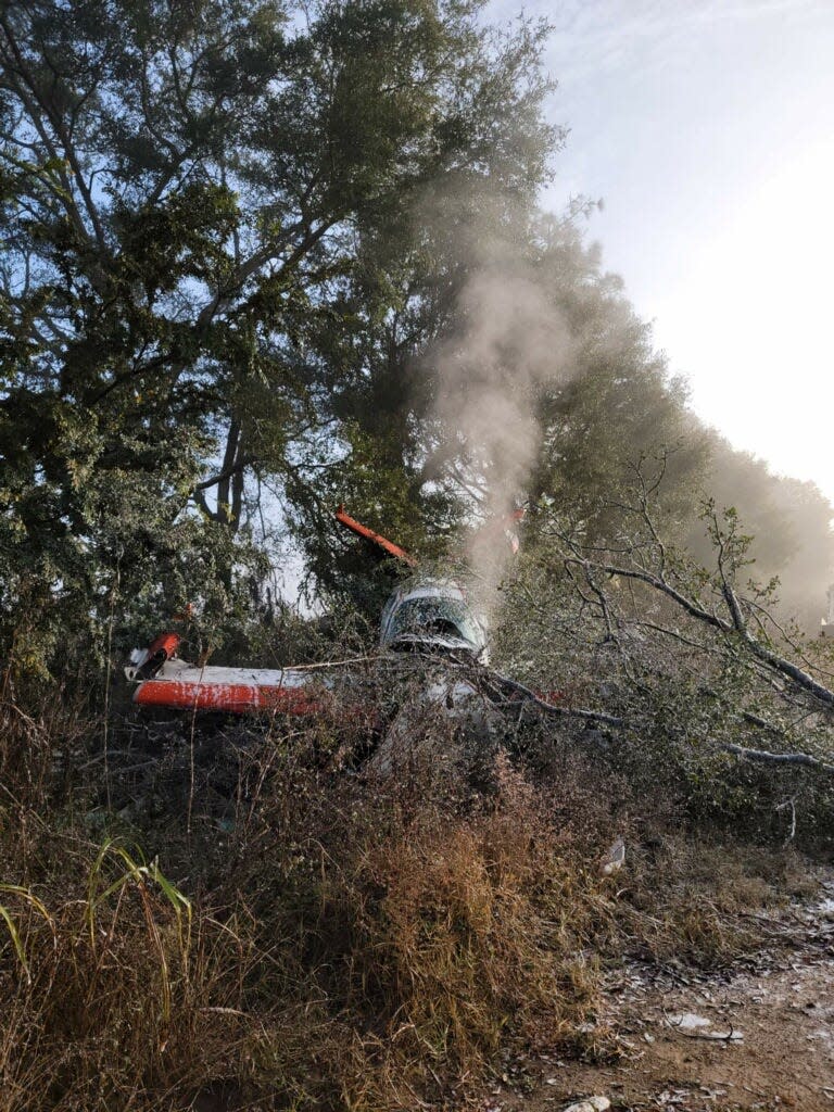 A small plane with only the pilot aboard crashed this morning, Tuesday, Dec. 7, 2021, in a wooded area off Tram Road. No one was injured.