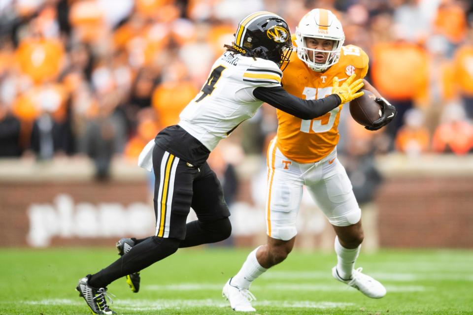 Tennessee wide receiver Bru McCoy (15) runs the ball while defended by Missouri defensive back Jalani Williams (4) during a game between Tennessee and Missouri in Neyland Stadium, Saturday, Nov. 12, 2022.