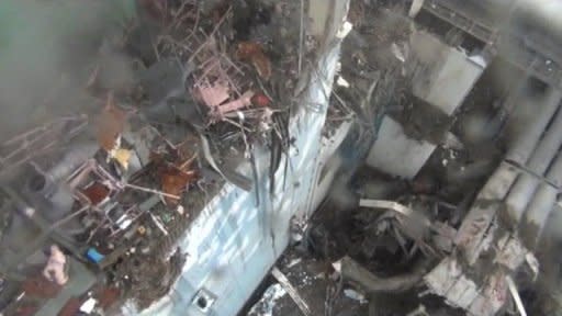 VIDEO - Aerial views show damage at Japan's disaster-hit Fukushima nuclear plant's number 4 reactor. The TEPCO footage was shot on March 24, 2011 from a crane. 