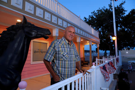 Dennis Hof, who owned the Moonlite BunnyRanch legal brothel and was a Republican candidate for Nevada State Assembly District 36, poses outside the brothel in Mound House, Nevada, U.S. June 16, 2018. REUTERS/Steve Marcus/File Photo