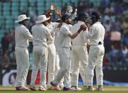 India's Ravichandran Ashwin (3rd L) celebrates along with his teammates after taking the wicket of South Africa's Dean Elgar during the third day of their third test cricket match in Nagpur, India, November 27, 2015. REUTERS/Amit Dave