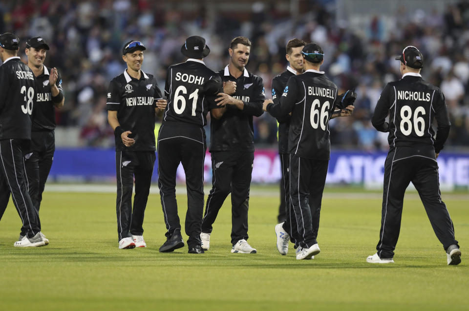 New Zealand's cricketers celebrate their victory at the end of the Cricket World Cup match against West Indies at Old Trafford in Manchester, England, Saturday, June 22, 2019. (AP Photo/Jon Super)