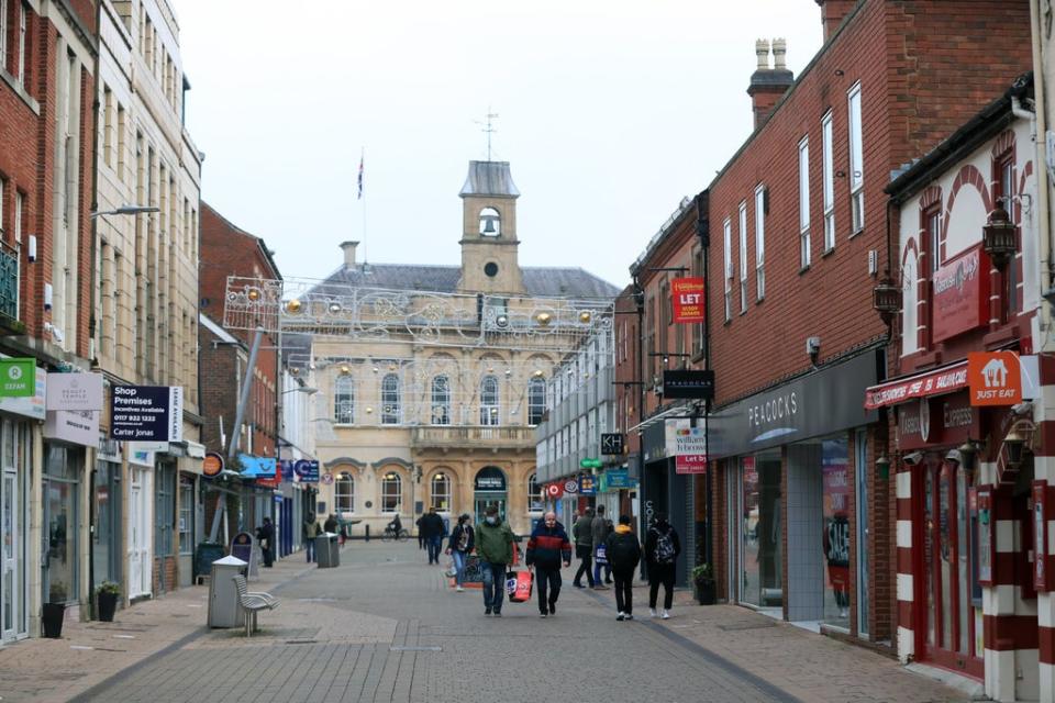 Shoppers on the high street in Loughborough, Leicestershire  (PA)
