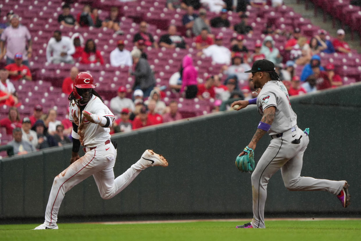 Elly De La Cruz is picked off second in the sixth inning Thursday. He later delivered a run-scoring single in the Reds' tying rally in the seventh.