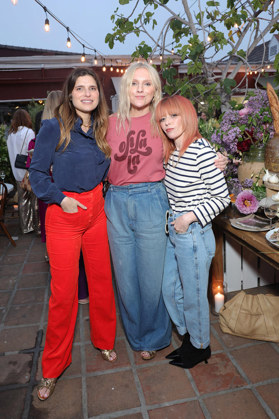 (L-R) Lake Bell, Laura Brown, and Natasha Lyonne pose as Laura Brown and Sézane fête the opening of their Brentwood Country Mart store on May 17, 2023 in Los Angeles, California.