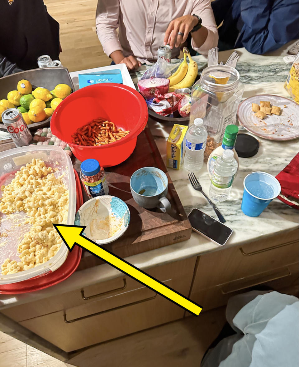 Various items laid out on a counter for midnight snacks and drinks after a wedding