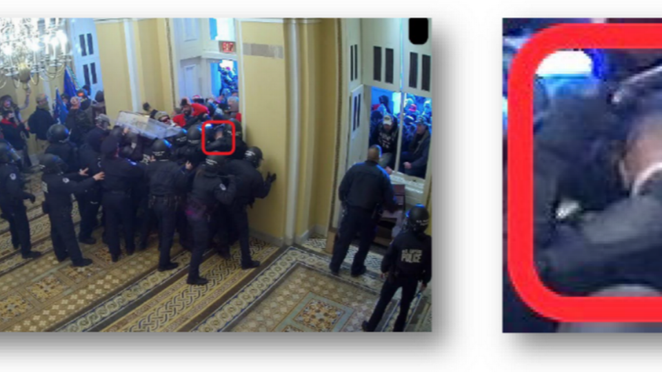 The FBI says this screen shot from U.S. Capitol Police closed-circuit video shows David Paul Daniel, now without his hat, at the front of a group of rioters carrying out a violent reentry into the Capitol through the Senate Wing door at 2:48 p.m. Jan. 6, 2021.