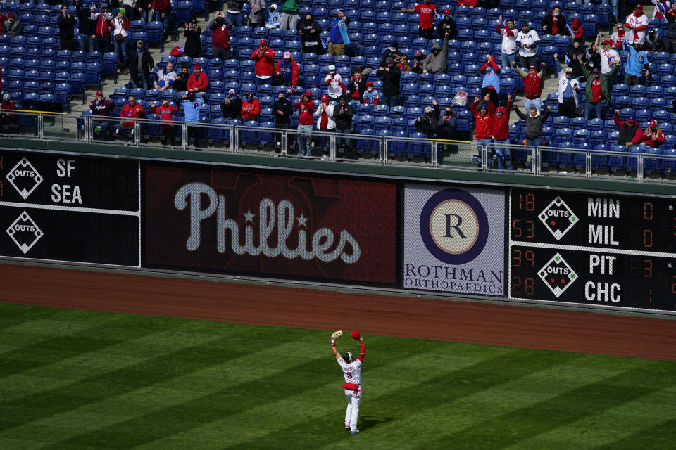 Philadelphia Phillies' Bryce Harper gestures to the fans during before an opening day baseball game against the Atlanta Braves, Thursday, April 1, 2021, in Philadelphia. (AP Photo/Matt Slocum)