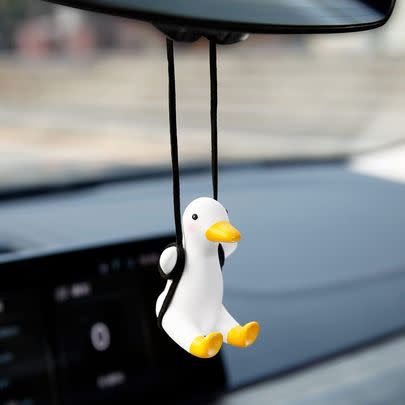 A lil' car mirror swinging duck accessory