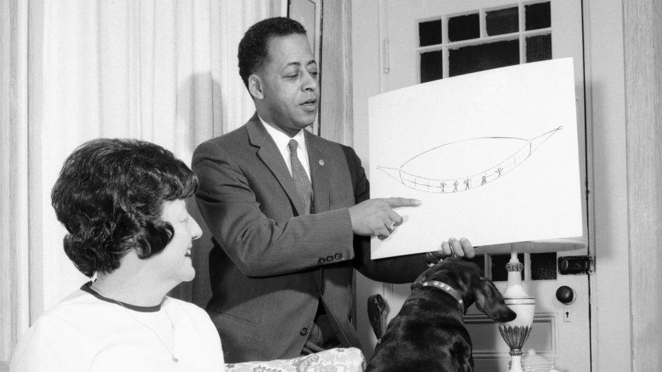 Barney Hill holds up a diagram as he and Betty Hill describe their experience. - Bettmann Archive/Getty Images