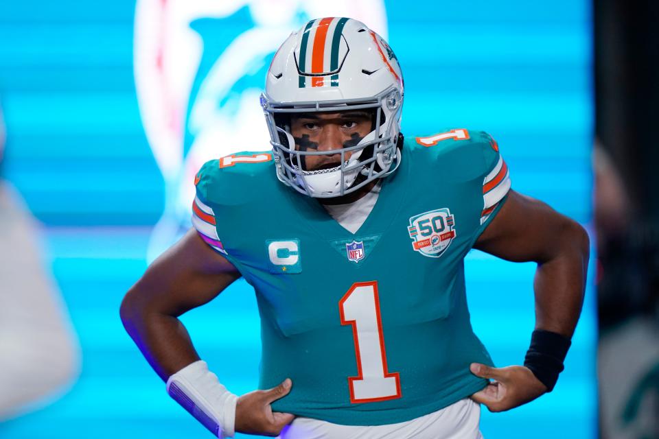 Miami Dolphins quarterback Tua Tagovailoa (1) enter the field before an NFL football game against the Pittsburgh Steelers, Sunday, Oct. 23, 2022, in Miami Gardens, Fla. (AP Photo/Wilfredo Lee )