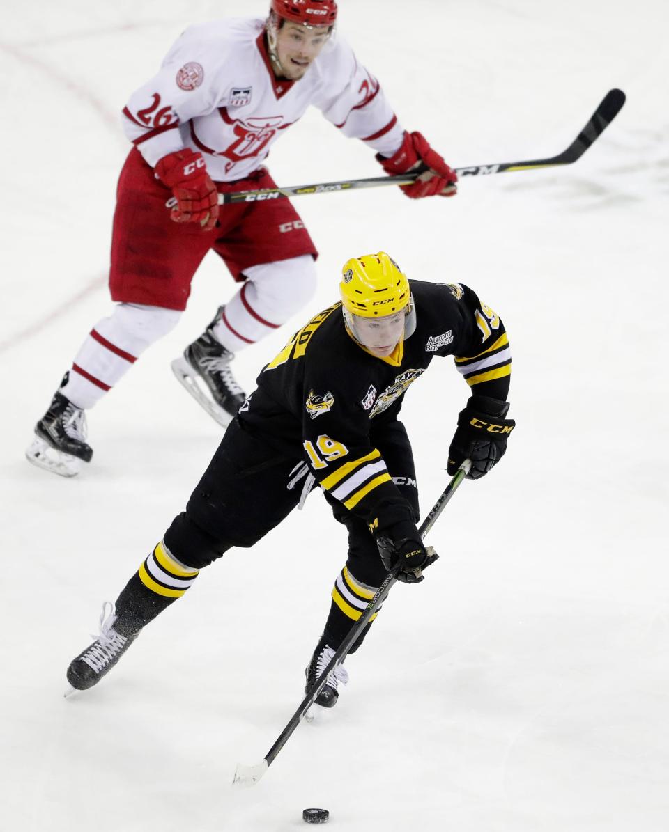 Green Bay Gamblers forward Brock Caufield (19) brings the puck up the ice against the Dubuque Fighting Saints April 17, 2018, in a Clark Cup playoff game at the Resch Center in Ashwaubenon.