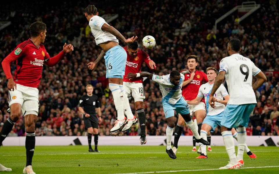 Manchester United's Casemiro, center, scores his side's second goal during the English League Cup third round