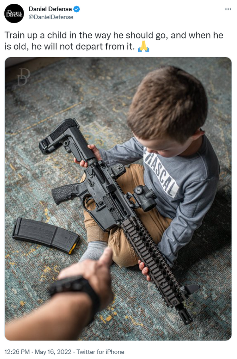 On May 16, Daniel Defense tweeted a photo of a young boy holding a rifle in his lap and captioned it with a Bible verse followed by a praying hands emoji: “Train up a child in the way he should go, and when he is old, he will not depart from it.”