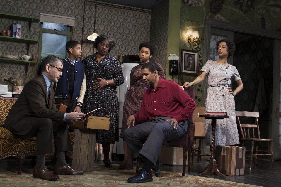 This image released by Philip Rinaldi Publicity shows David Cromer, from left, Bryce Clyde Jenkins, LaTanya Richardson Jackson, Anika Noni Rose, Denzel Washington and Sophie Okonedo during a performance of "A Raisin in the Sun," at the Ethel Barrymore Theatre in New York. (AP Photo/Philip Rinaldi Publicity, Brigitte Lacombe)