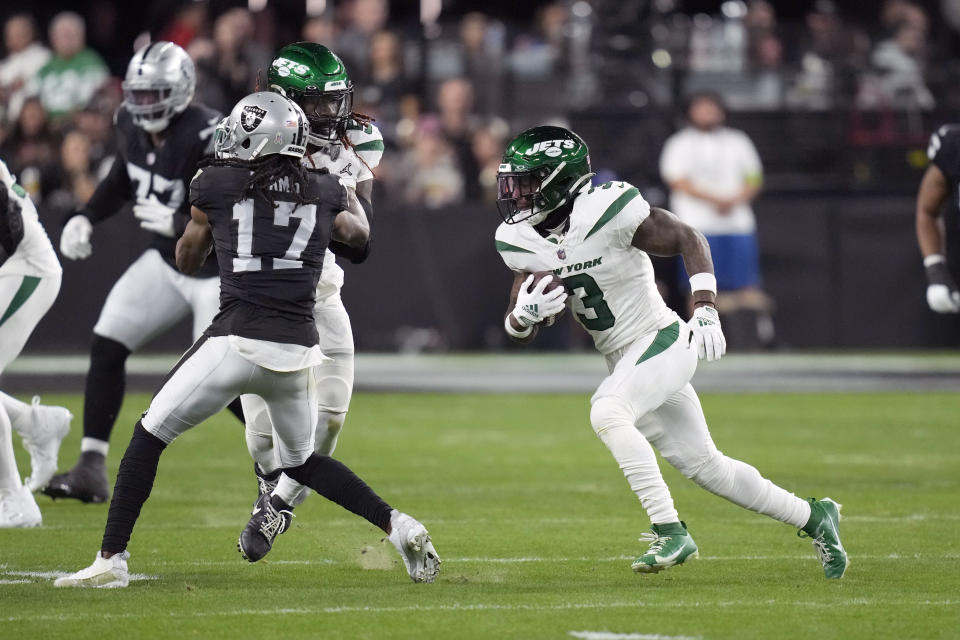 New York Jets safety Jordan Whitehead runs with the ball after intercepting a pass intended for Las Vegas Raiders wide receiver Davante Adams (17) during the first half of an NFL football game Sunday, Nov. 12, 2023, in Las Vegas. (AP Photo/John Locher)