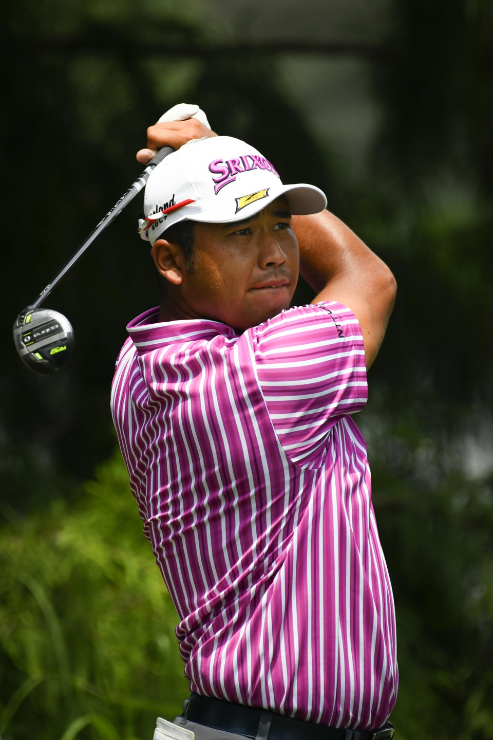 Hideki Matsuyama, of Japan, hits from the 12th tee during the first round in the World Golf Championship-FedEx St. Jude Invitational tournament, Thursday, Aug. 5, 2021, in Memphis, Tenn. (AP Photo/John Amis)