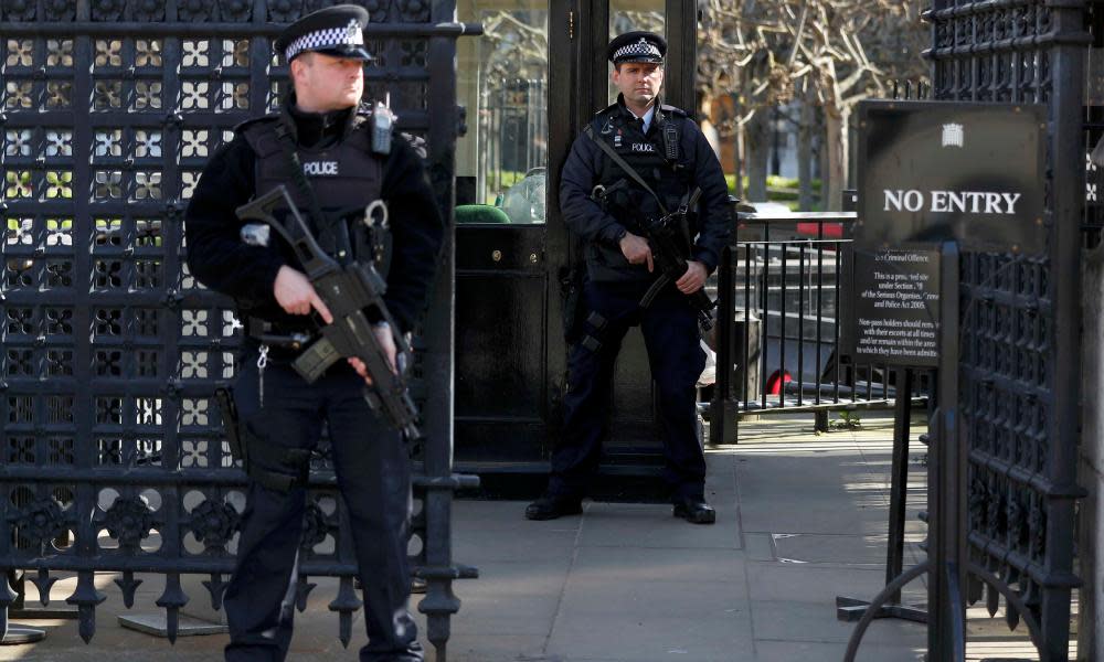 Armed police outside an entrance to the Houses of Parliament yesterday. Last week’s attack has cast doubt over arrangements for restoration work. 