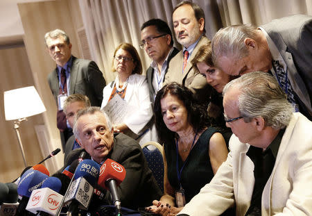 Spanish forensic doctor Aurelio Luna, together with a group of forensic experts, speaks during a news conference on the report of investigations into probable causes of death of Chilean poet and Nobel laureate Pablo Neruda in Santiago, Chile October 20, 2017. REUTERS/Rodrigo Garrido