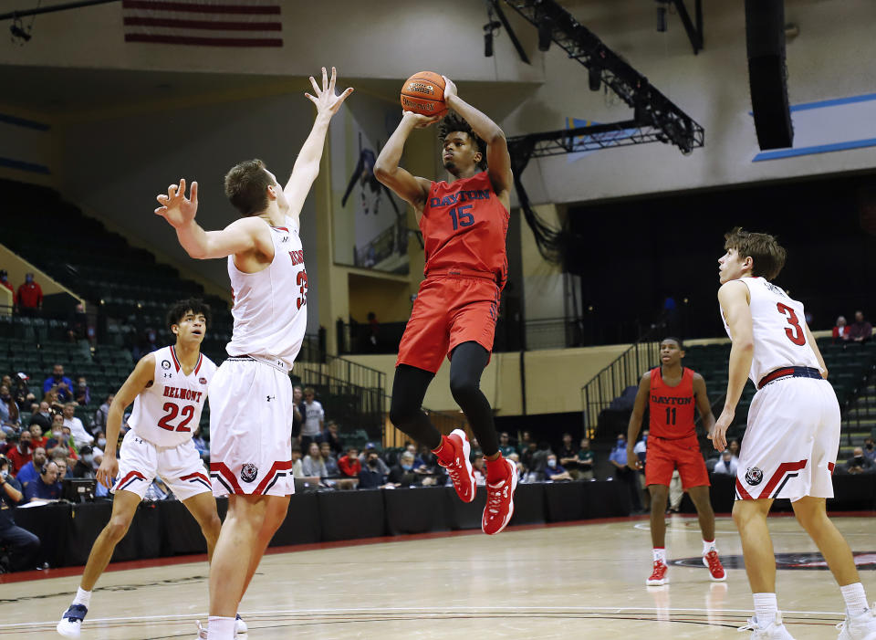 FILE - Dayton forward Daron Holmes II (15) shoots in front of Belmont center Nick Muszynski during the second half of an NCAA college basketball game Nov. 28, 2021, in Lake Buena Vista, Fla. Holmes, the A-10 rookie of the year in 2021-22, returns with former Georgia transfer Toumani Camara to give Dayton what should be one of the nation's best frontcourts. (AP Photo/Jacob M. Langston, File)