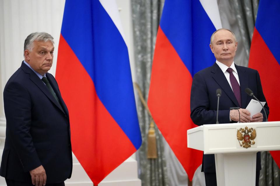 Russian President Vladimir Putin, right, and Hungarian Prime Minister Viktor Orban leave a hall after their press statement following their talks in the Kremlin in Moscow, Russia, Friday, July 5, 2024. Hungarian Prime Minister Viktor Orban visited Moscow on Friday for a rare meeting by a European leader with Russian President Vladimir Putin and discussed peace proposals for Ukraine, which triggered condemnation from Kyiv and some European leaders and officials. (AP Photo/Alexander Zemlianichenko)