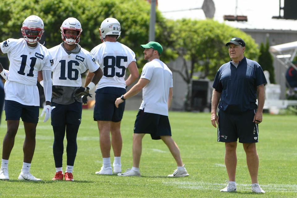 Patriots coach Bill Belichick watches players practice during an OTA earlier this spring.