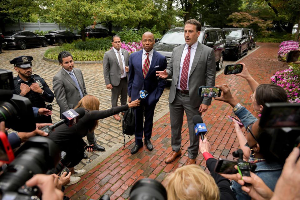 Eric Adams and Alex Spiro are interviewed by members of the press. (Victor J. Blue/Bloomberg via Getty Images)