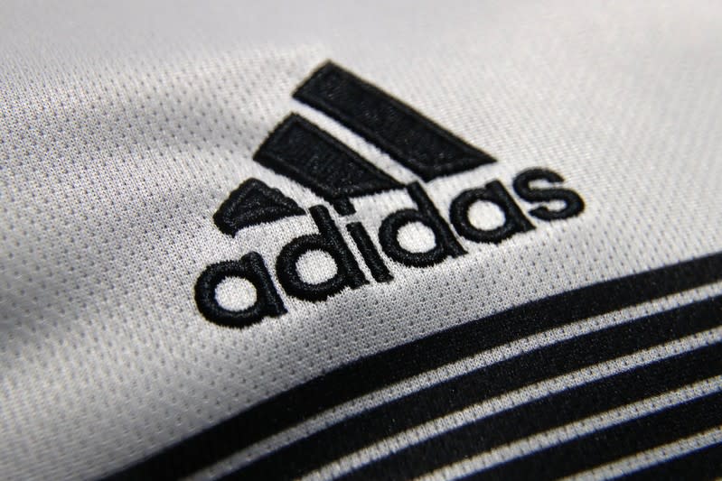 An Adidas sign is seen before the company's annual news conference in Herzogenaurach