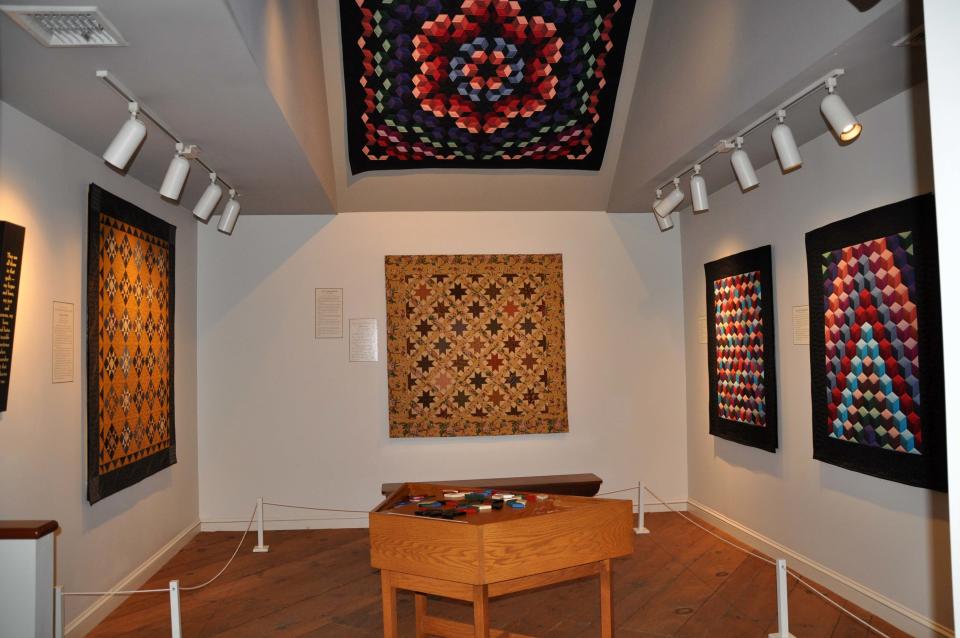 This 2012 photo released by The Quilt Museum at The Old Country Store shows quilts displayed as part of the "Favorite Reproduction Quilts by Jo Morton," at The Quilt Museum at The Old Country Store in Intercourse, Pa. The harvest season is nearing its glorious end, and the culture, architecture and history of Pennsylvania's Amish country can be seen for free in Lancaster County, where many Amish settled, starting in the early 1700s. (AP Photo/The Quilt Museum at The Old Country Store)