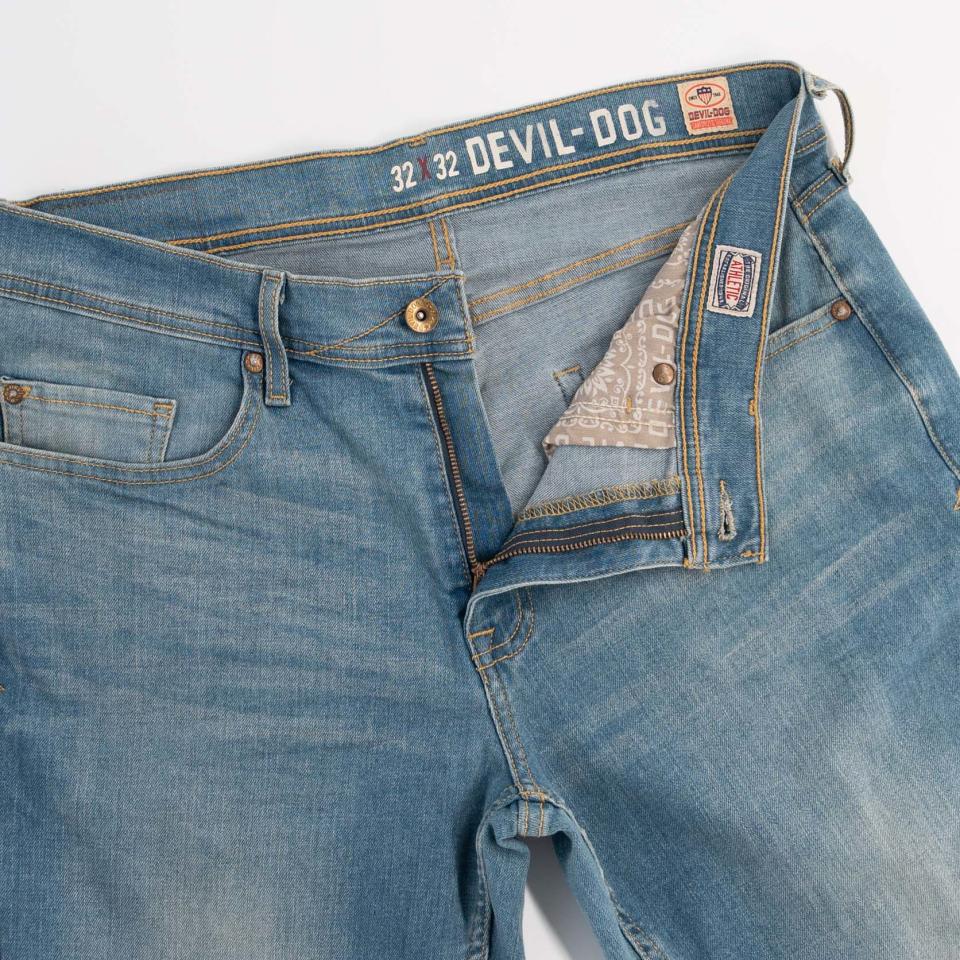 The jeans have vintage detailing.