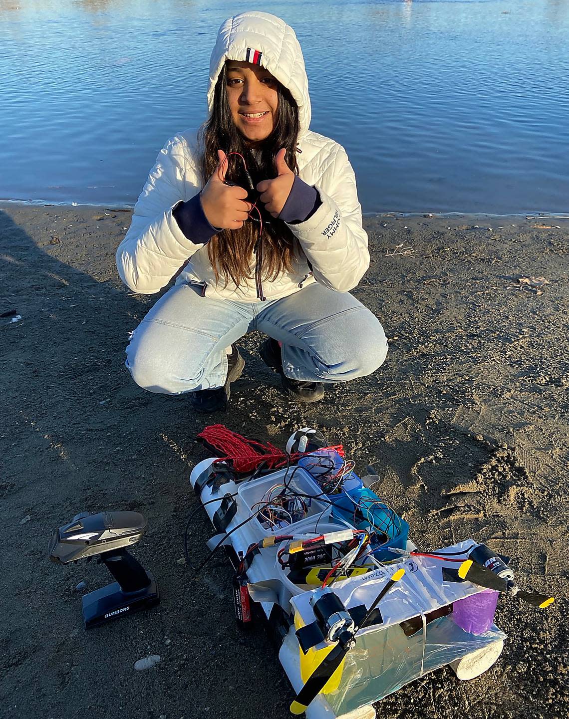 Hanford High student Prayrona Choudhury prepare to launch her marine-biology invention named AquaTranslate, a device that uses a rover to quickly sample and analyze water, for a run on the Columbia River.