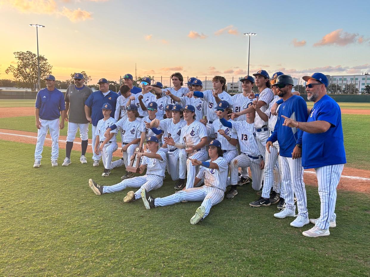 The John Carroll baseball team poses for photos after defeating Master's Academy 11-1 in the District 13-2A title game on Thursday, May 2, 2024, from the Lawnwood Baseball Complex in Fort Pierce.