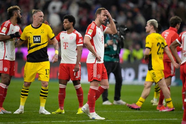 Harry Kane, centre, saw his Bayern Munich side slip 13 points adrift of Bundesliga leaders Bayer Leverkusen (Matthias Schrader/AP)