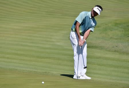 Feb 18, 2018; Pacific Palisades, CA, USA; Bubba Watson putts on the fourth green during the final round of the Genesis Open golf tournament at Riviera Country Club. Orlando Ramirez-USA TODAY Sports