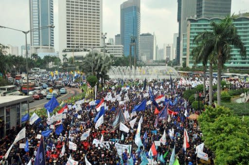 Thousands of Indonesian workers march towards the presidential palace during the May Day protests in Jakarta on May 1. Indonesian workers held a peaceful rally in Jakarta on May 1 demanding better pay and protection of job security