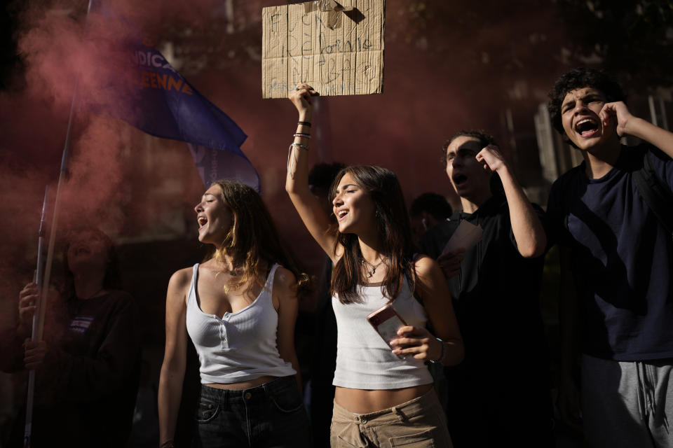 Protesters shout during a demonstration, Tuesday, Oct. 18, 2022 in Marseille, southern France. France is in the grip of transport strikes and protests for salary raise on Tuesday that threaten to dovetail with days of wage strikes that have already hobbled fuel refineries and depots, sparking chronic gasoline shortages around the country. (AP Photo/Daniel Cole)