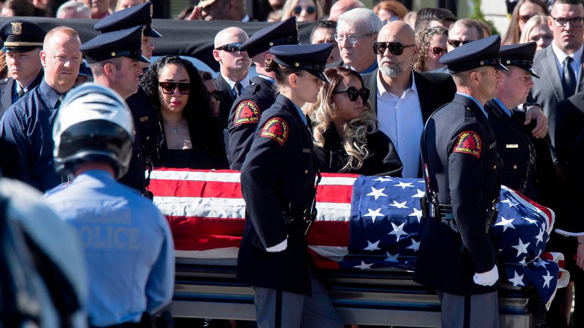 The casket of Raleigh police officer Gabriel Torres is carried into Cross Assembly Church on Saturday, Oct. 22, 2022, in Raleigh, N.C. Torres, 29, was one of five people fatally shot near the Hedingham neighborhood on Oct. 13.