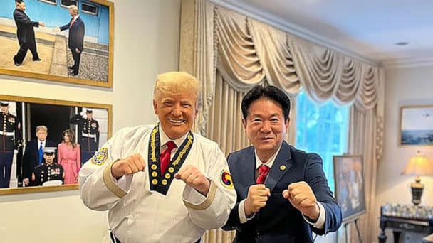 PHOTO: Kukkiwon World Taekwondo Headquarters president Lee Dong-sup with former president Donald Trump in Trump's Mar-a-Lago office, in a photo posted to the organizations Facebook page, Nov. 19, 2021. (Courtesy of Kukkiwon World Taekwondo Headquarters)