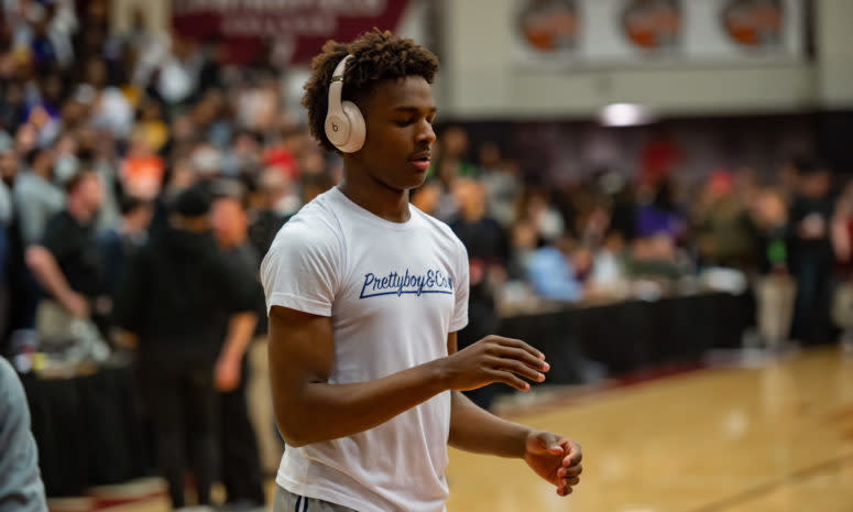 Bronny James warms up before a high school game.