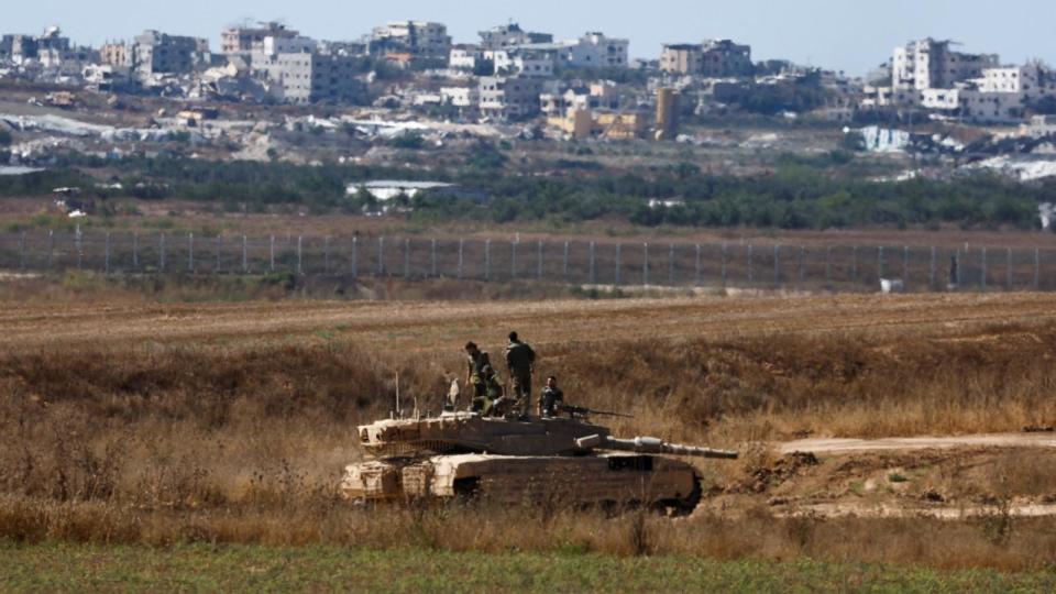 PHOTO: Israeli soldiers stand on top of a tank, in position near the Israel-Gaza border, amid the ongoing conflict between Israel and Hamas, as seen from Israel, June 18, 2024.  (Amir Cohen/Reuters)