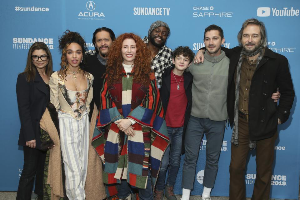 Director Alma Har'el, fourth from left, poses with actors from left to right, Laura San Giacomo, FKA Twigs, Clifton Collins, Byron Bowers, Noah Jupe, Shia LaBeouf, and Craig Stark at the premiere of "Honey Boy" during the 2019 Sundance Film Festival, Friday, Jan. 25, 2019, in Park City, Utah. (Photo by Danny Moloshok/Invision/AP)