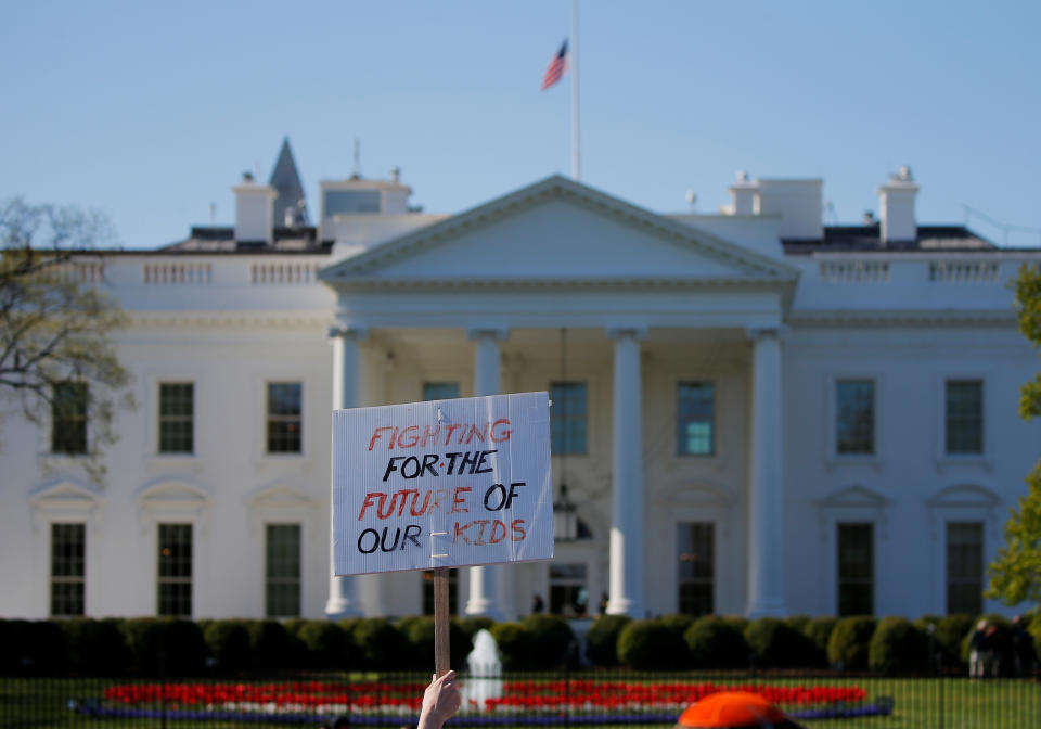 <p>Students observe 19 minutes of silence outside the White House, as part of a nationwide walk-out of classes to mark the 19th anniversary of the Columbine High School mass shooting, in Washington, D.C., April 20, 2018. (Photo: Brian Snyder/Reuters) </p>