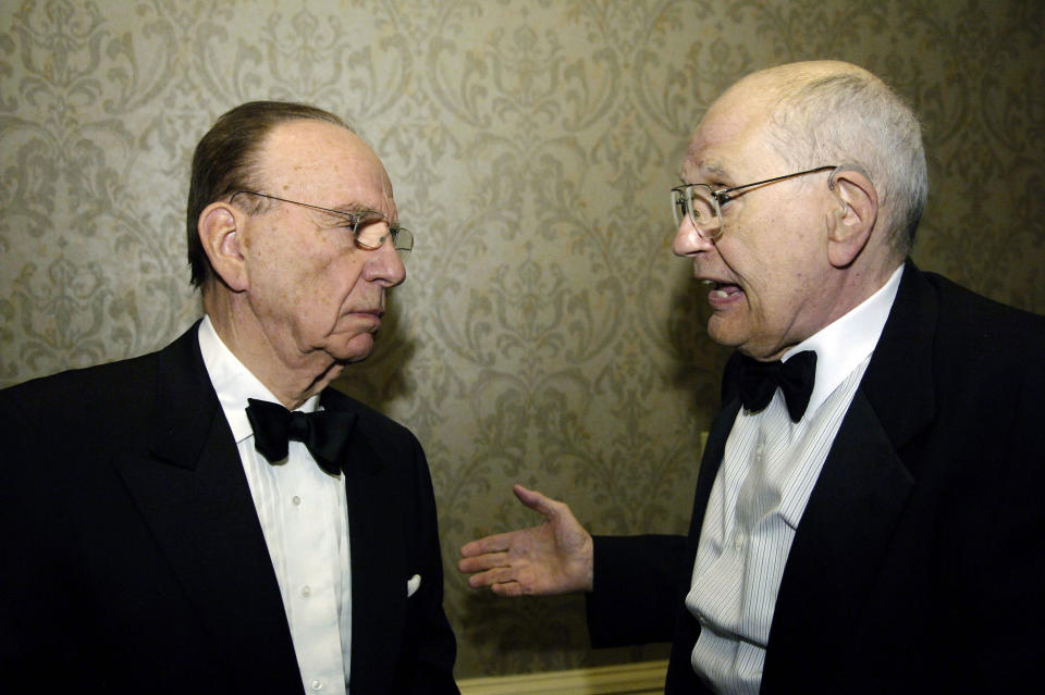 Media mogul Rupert Murdoch (left) talks with Dingell at a pre-party for the annual White House Correspondents' Association dinner in Washington on April 21, 2007.