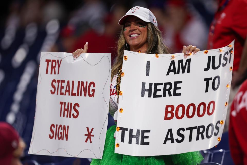 Phillies fan hold up signs before Game 3.